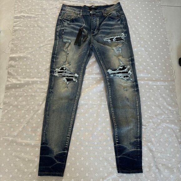 Amiri Distressed Hole Jean In Blue - Picture 1 of 7